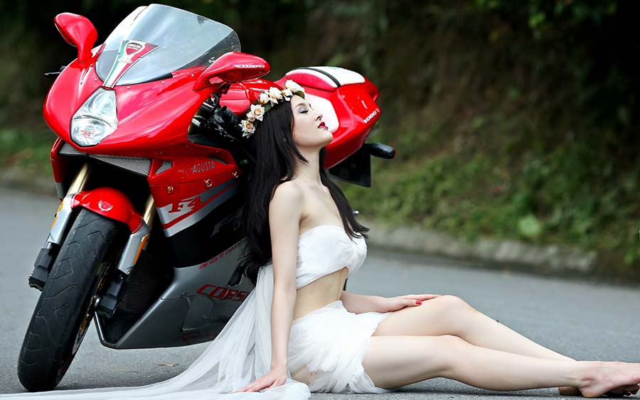 Beautiful girls and motorcycles in Roseau